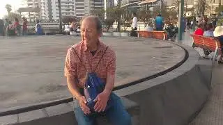 Sad old guy acompanying a love song after he lost his wife in Lima Peru