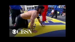 Marine vet crawls across Boston Marathon finish line