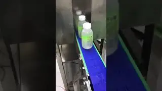 Sleeve labeling machine for juice bottles