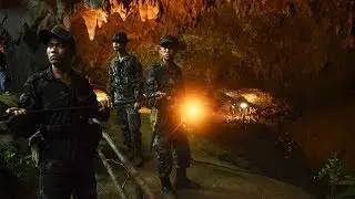 US forces and British divers join search for boys trapped in cave