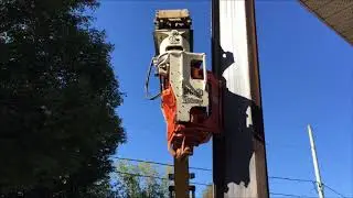 The vibratory pile drivers in action