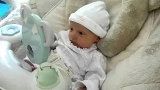 Evie's First Musical Swing Ride