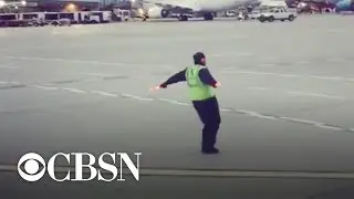 Airport employee caught dancing on tarmac