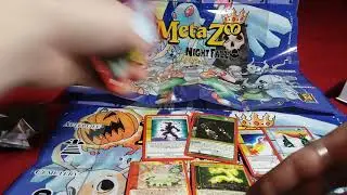opening some MetaZoo  packs still searching for that full Holo Mothman