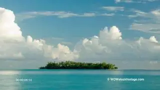 Tropical Island with puffy white clouds BS0341