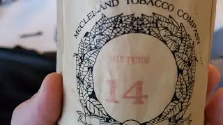Opening a tin of 1979 McClellands No. 14 at the Chicago Pipe Show 2023