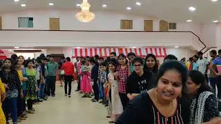 Explaining the rules of hula hoop team game for huge audience Chennai Event emcees and entertainers