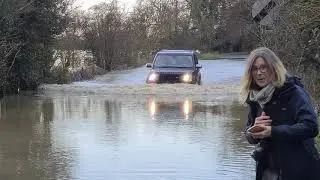 Flood waters on Earsham Dam in Norfolk