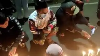 Candles Lit at Vigil After Indonesia Stadium Crush Kills At Least 125 People