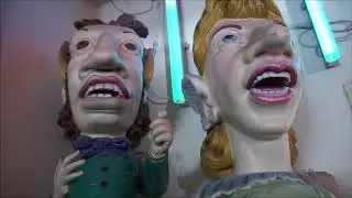 Rollercoaster Car and Fun House Statues from the historic Pike.