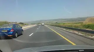 Driving on Highway 2 in Israel with view of Carmel Mountain.