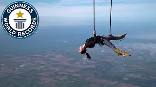 Trapeze act from hot air balloon! - Guinness World Records