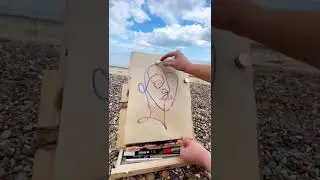 Drawing a minimalist one line portrait on the beach without lifting my pen