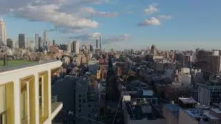 High angle views of the High Line, former railway line, and vehicle traffic in the streets of