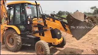JCB 3DX Loading Rockery Stone, into a Dump Truck