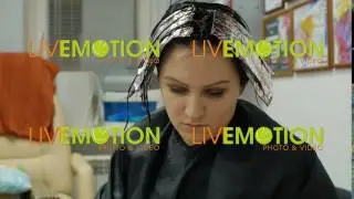 Young woman reading a magazine in a hair salon