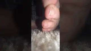 Male feet and toes rubbing together close up