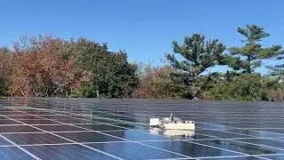 The Peak Solar Pro team uses robots to clean solar panels.