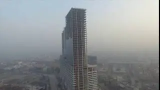 Aerial stock footage India under construction yet huge building in Noida