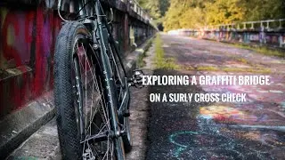 Exploring a graffiti bridge on the Surly Cross Check