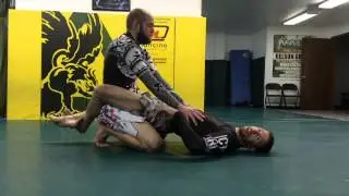 Arm in guillotine from guard (gorilla grip)