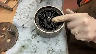 1240.  How to remove the spring from the center shaft arbor on the Chaney motor￼