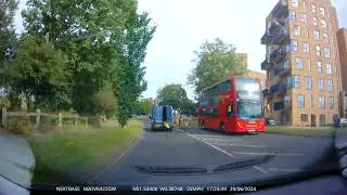 Van driving around London with back door open using a yellow marker.