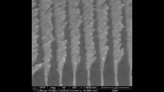 Reconfiguring gratings of slanted plasmonic nanocolumns by ion beam irradiation