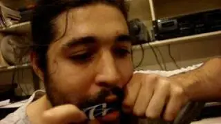 Slim DEFALLA plays the phone card Jew's harp