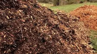 Making a mountain of fertilizer / compost  - all natural and organic from manure and wood chips