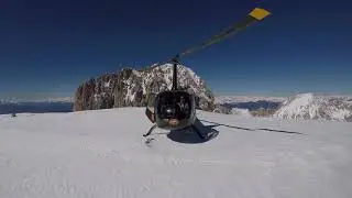 Helicopter R66 following the Alps. Austria to France.