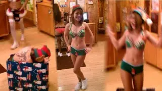 Hooters girl jumps out of a Christmas package taken in December 2010