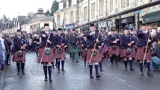 Afternoon parade along Atholl Road Pitlochry by Vale Of Atholl Pipe Band on New Year's Day 2020
