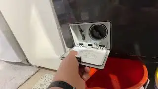 Cleaning out front load washer pump button catcher.  