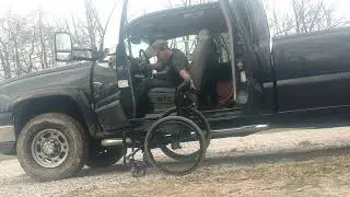 Paraplegic pickup truck transfer and stow wheelchair including rear seat raise