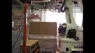 Line equipped with robot arm to pack and palletize loungers