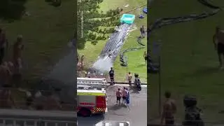 Firefighters spray giant slip 'n slide for happy partygoers