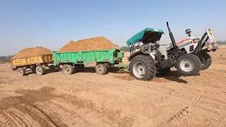 Eicher 557 tractor stuck with 2 loaded trolley in the field