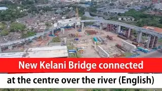 New Kelani Bridge connected at the centre over the river (English)