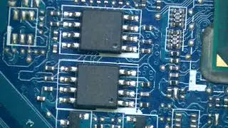 laptop motherboard  inscaption with microscope