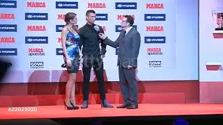 Real Madrid football player Cristiano Ronaldo receives from hand of Monica Martinez  Football Award 