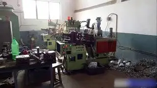 belt buckle manufacturing workshop vibratory finishing