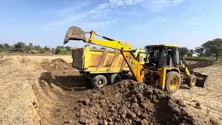 JCB 3dx backhoe machine loding mud in Mahindra 575 tractor trolle 