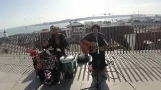 psychedelic street musicians with the amazing Lisbon view