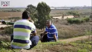 Curious citizens overlook Iron Dome defense system Battery outside Tel Aviv