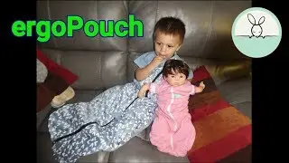 Dave & Bella try on ErgoPouches: Sleep Suit Bags & Baby Swaddle Bag on baby doll