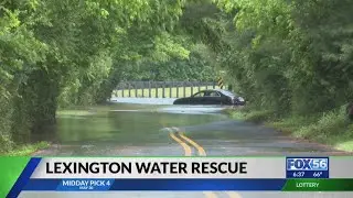 Couple rescued from flooded Lexington road as officials warn to turn around