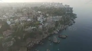 D-Log M. Antalya, Turkey. Aerial drone view of Hidirlik Tower on rocky cliff with Karaalioglu Par...