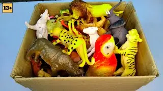Plastic animals and real animals video parrot, lion, giraffe, crocodile, donkey, elephant, cow