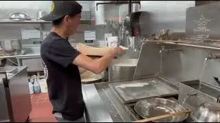 Chef Ming Zhang slicing noodles at Kung Fu Kitchen in New Haven